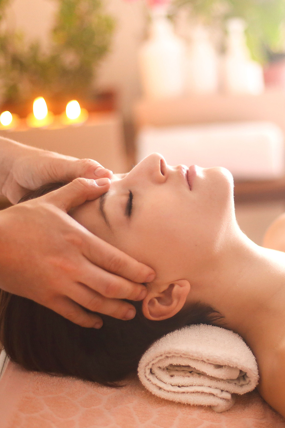 Woman getting a facial massage Woman getting a facial massage